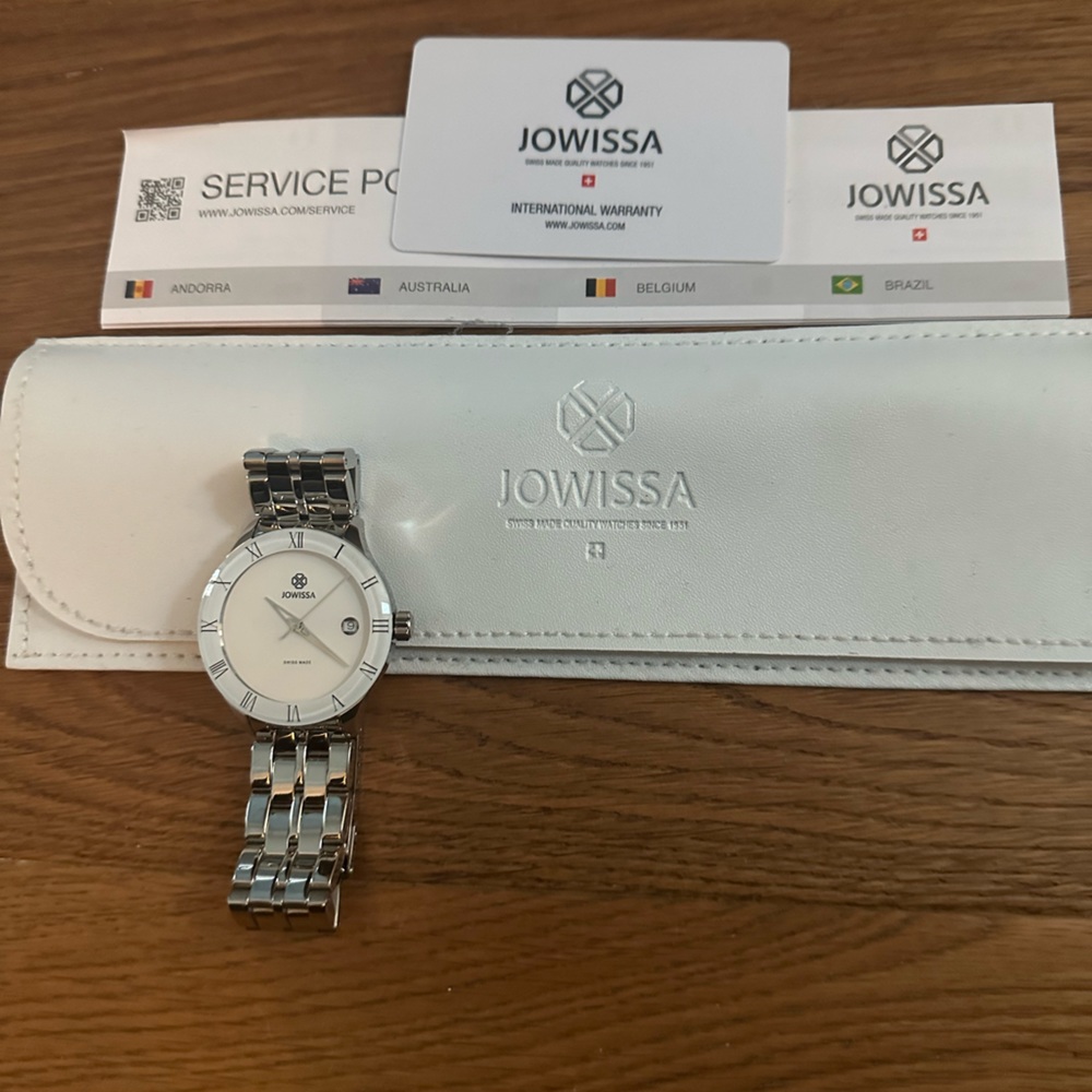 New watch from Switzerland with all of its tags, warranty, Needs a new battery